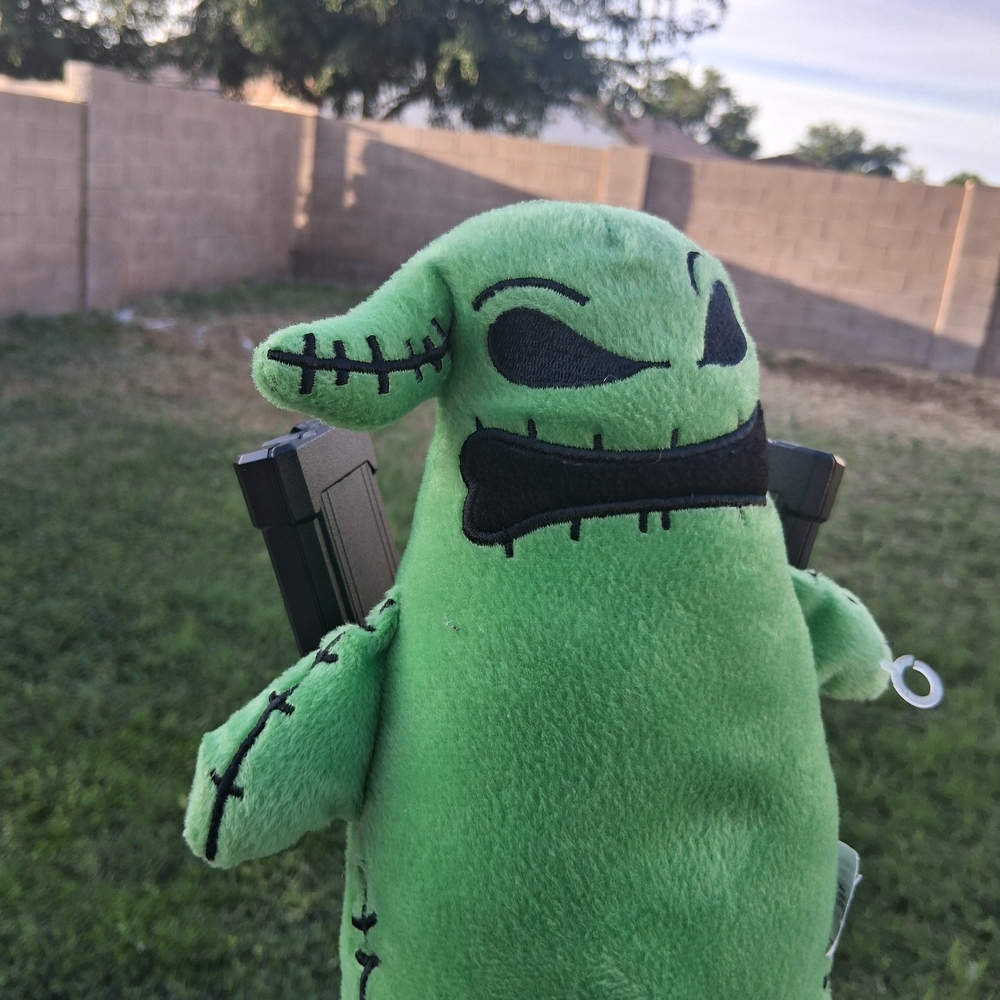 Disney Green Plush Monster Keychain with Black Embroidered Details